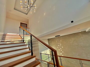 Experience grandeur in this brand-new house and lot with high ceilings, nestled in the exclusive Greenwoods Executive Village