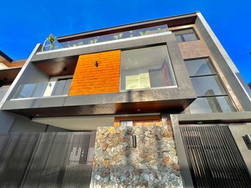 Experience grandeur in this brand-new house and lot with high ceilings, nestled in the exclusive Greenwoods Executive Village