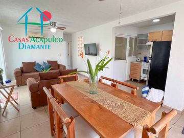 Departamento en renta vacacional con balcón y vista a las áreas comunes