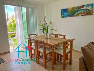Departamento en renta vacacional con balcón y vista a las áreas comunes