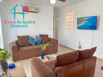 Departamento en renta vacacional con balcón y vista a las áreas comunes