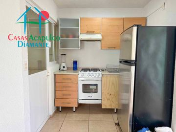 Departamento en renta vacacional con balcón y vista a las áreas comunes