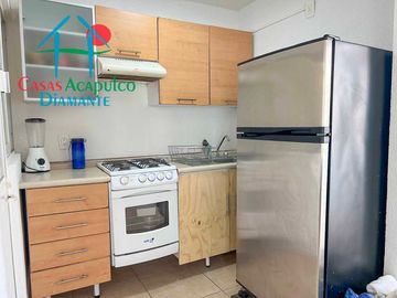 Departamento en renta vacacional con balcón y vista a las áreas comunes