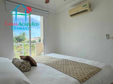 Departamento en renta vacacional con balcón y vista a las áreas comunes