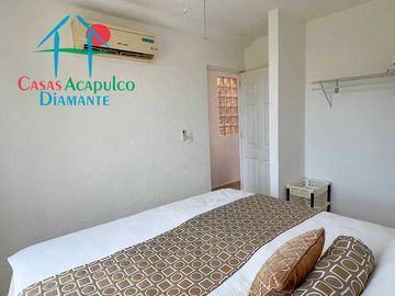 Departamento en renta vacacional con balcón y vista a las áreas comunes