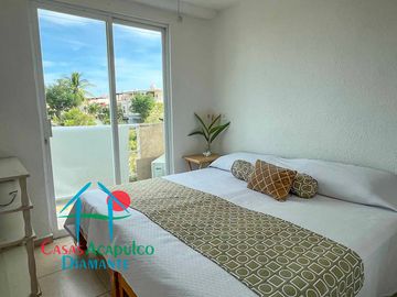 Departamento en renta vacacional con balcón y vista a las áreas comunes