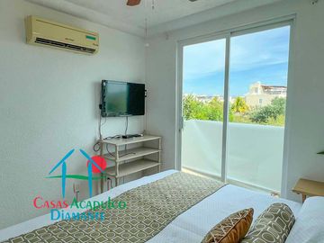 Departamento en renta vacacional con balcón y vista a las áreas comunes