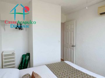 Departamento en renta vacacional con balcón y vista a las áreas comunes