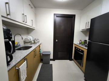 2BR condo at Uptown Parksuites Tower 1 - High floor unit with city view