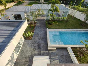 Modern Luxury Private Pool Villa for sale, surrounded by natural garden, a local quiet village and convenient stores.