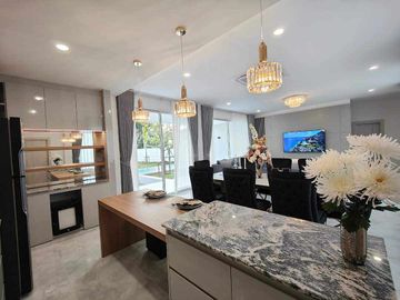 Modern Luxury Private Pool Villa for sale, surrounded by natural garden, a local quiet village and convenient stores.