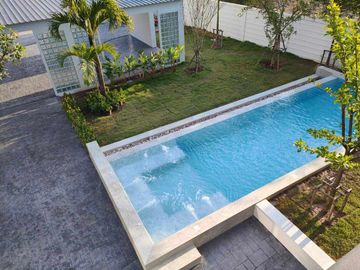 Modern Luxury Private Pool Villa for sale, surrounded by natural garden, a local quiet village and convenient stores.