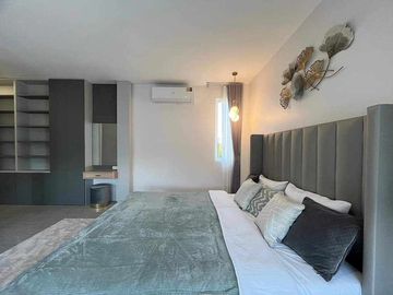 Modern Luxury Private Pool Villa for sale, surrounded by natural garden, a local quiet village and convenient stores.