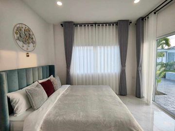 Modern Luxury Private Pool Villa for sale, surrounded by natural garden, a local quiet village and convenient stores.
