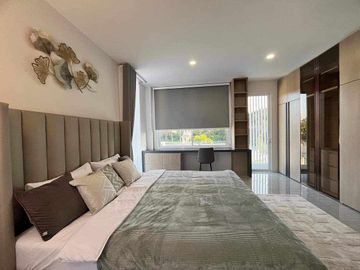 Modern Luxury Private Pool Villa for sale, surrounded by natural garden, a local quiet village and convenient stores.