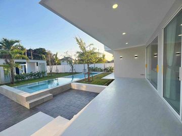 Modern Luxury Private Pool Villa for sale, surrounded by natural garden, a local quiet village and convenient stores.