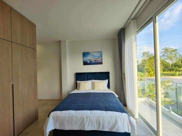 Modern Luxury Private Pool Villa for sale, surrounded by natural garden, a local quiet village and convenient stores.