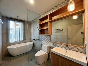 Modern Luxury Private Pool Villa for sale, surrounded by natural garden, a local quiet village and convenient stores.