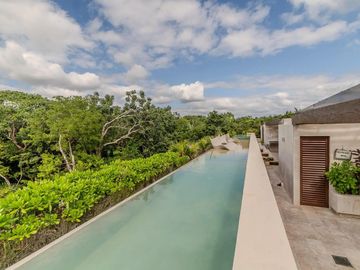 Vista verde garantizada! Exclusiva Propiedad de 2 recámaras con Jardín y Alberca en Luum Zama, Aldea Zama