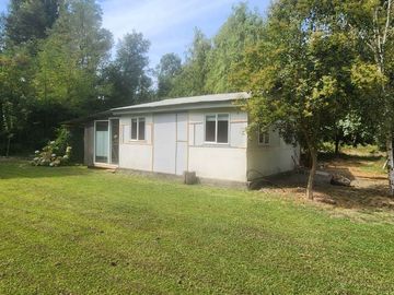 Venta parcela con Casas y plantación de arandanos