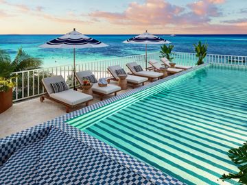 EXCLUSIVO DEPARTAMENTO FRENTE AL MAR DE PLAYA DEL CARMEN