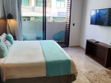 Estudio amueblado: centro de Playa del Carmen, rooftop vista al mar, a pasos de la Quinta Avenida