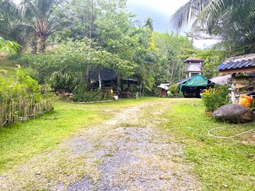 Nearly 25 Rai of Land with Mountain View, Farmhouse & Public Creek for Sale in Thai Mueang, Phangnga