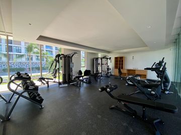DEPARTAMENTO CON PRECIO DE OPORTUNIDAD EN LUJOSO DESARROLLO EN PUERTO CANCUN, DISEÑO ITALIANO