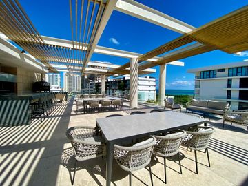 DEPARTAMENTO CON PRECIO DE OPORTUNIDAD EN LUJOSO DESARROLLO EN PUERTO CANCUN, DISEÑO ITALIANO