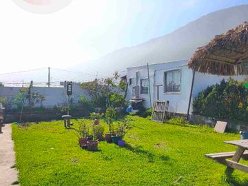 Gran Oportunidad en Totoralillo: Terreno con Casa Principal y Cabañas de Arriendo