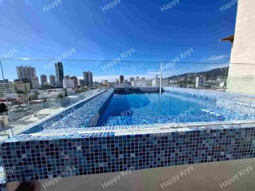 Departamento en renta en Fraccionamiento Costa azul  cerca de playa, primer nivel, con elevador, alberca y palapa en roof garden