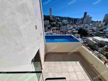 Departamento en renta en Fraccionamiento Costa azul  cerca de playa, primer nivel, con elevador, alberca y palapa en roof garden