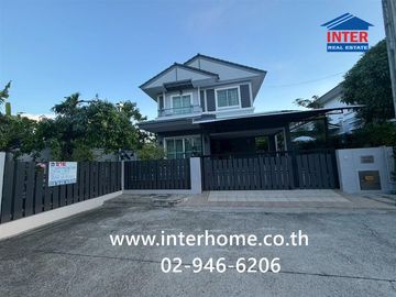 Two-story detached house, 64.5 sq.w., Chonlada Suvarnabhumi Village. Krungsri Ayutthaya Bank is located at the entrance of the soi (lane), Soi Ladkrab