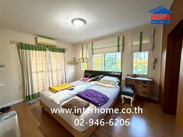 Two-story detached house, 64.5 sq.w., Chonlada Suvarnabhumi Village. Krungsri Ayutthaya Bank is located at the entrance of the soi (lane), Soi Ladkrab