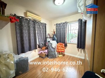 Two-story detached house, 64.5 sq.w., Chonlada Suvarnabhumi Village. Krungsri Ayutthaya Bank is located at the entrance of the soi (lane), Soi Ladkrab