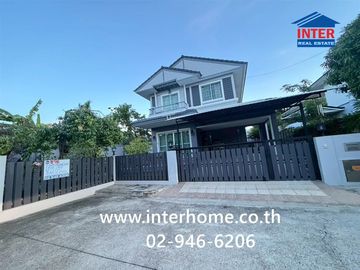 Two-story detached house, 64.5 sq.w., Chonlada Suvarnabhumi Village. Krungsri Ayutthaya Bank is located at the entrance of the soi (lane), Soi Ladkrab