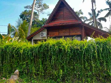 jual tanah kawasan villa dekat pantai pasut contour datar Los sungai di tabanan bali.