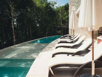 Condo amueblado, vista al campo de golf, venta, Tulum Country Club