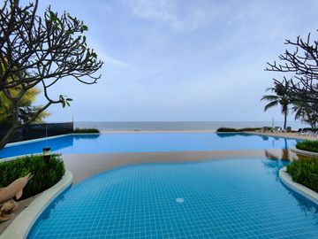 Condo for sale at Baan Plearn Talay. Cha-am, Phetchaburi Province condo resort style next to private beach very large facilities, big gardens , 2 swim