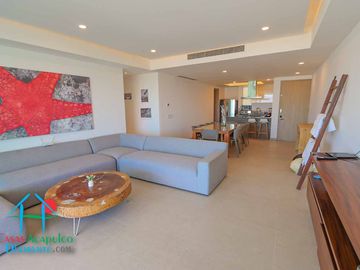 Departamento en renta vacacional. Terraza con vista a las albercas, jardines y parcial al mar