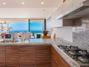Departamento con vista al mar, alberca infinity y area de asador, spa y gimnasio, venta en Cabo San Lucas.