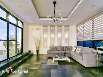 white house with swimming pool for sale in amara subdivision liloan cebu