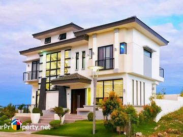 white house with swimming pool for sale in amara subdivision liloan cebu