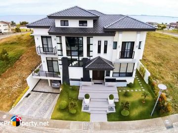 white house with swimming pool for sale in amara subdivision liloan cebu
