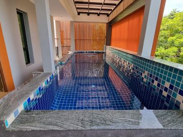 Kristada Nakhon 21 Bangna opposite Mega Bangna has a modern contemporary home for sale with a pool.