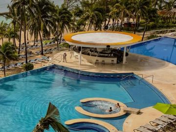 Departamento en venta, en residencial frente al mar, Playa del Carmen.
