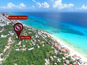 Casa de 4 recamaras con alberca privada, acceso al mar 2 departamentos independientes en venta en Playacar Fase 2.