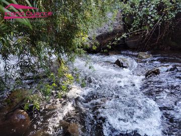 VENDO HERMOSA PARCELA CON MAJESTUOSO PAISAJE CORDILLERANO RODEADA POR ESTERO EN KM46.5 A LAS TERMAS DE CHILLAN