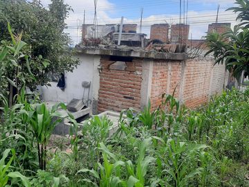 CHECA, vendo terreno 1.500m, con casa y local comercial, servicios básicos