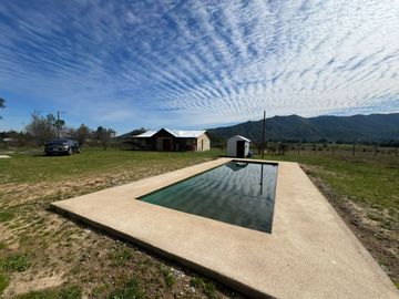 Parcela con 3 cabañas amobladas, cambio de Uso de Suelo y Urbanización en trámite.